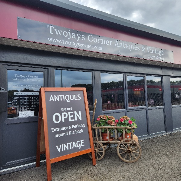 Front of
                shop showing A-board