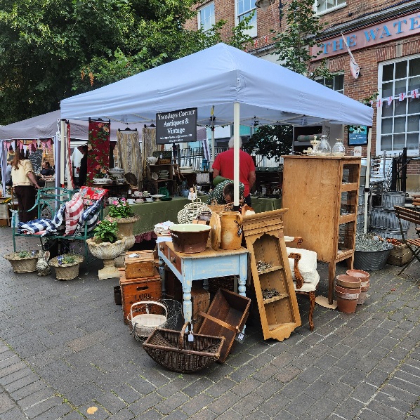Whitchurch Vide Grenier stand
                                showing antiques on sale